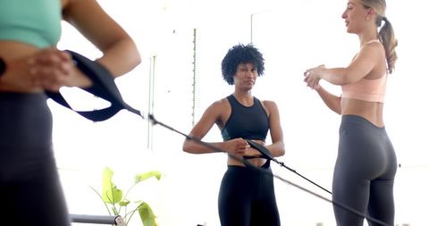 Diverse Women Engaging in Resistance Band Workout