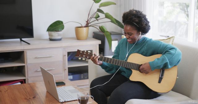 Young Woman Taking Online Guitar Lesson in Cozy Living Room - Download Free Stock Images Pikwizard.com