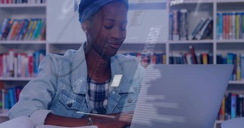 Young woman studying with laptop in library with code overlay for online learning and STEM