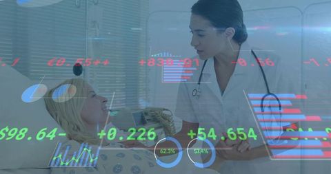 Clinician comforting patient in hospital bed holding hand with digital analytics overlay
