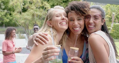Joyful Group of Friends Sharing Heartfelt Moment at Garden Party