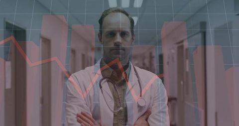 Confident Male Doctor Analyzing Medical Data in Hospital Hallway