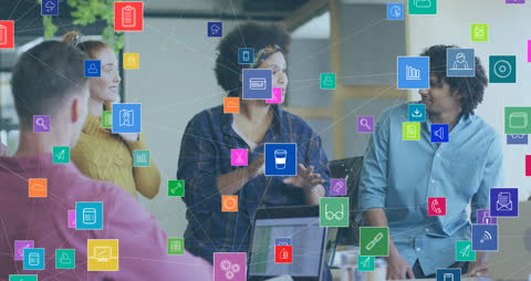 Diverse Team Collaborating with Overlay of Digital Icons in Modern Office