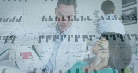 Doctor using defibrillator with overlay of ecg graphs in clinic