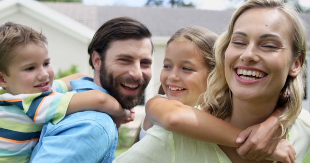 Happy Family Outdoors, Parents Giving Children Piggyback Rides - Download Free Stock Images Pikwizard.com