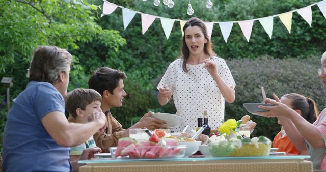 Family Enjoying Outdoor Dinner in Garden - Download Free Stock Images Pikwizard.com