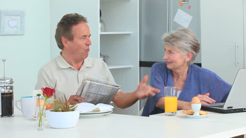 Senior Couple Morning Routine in Modern Kitchen