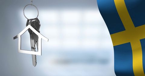 House Key with Swedish Flag Representing Real Estate Market