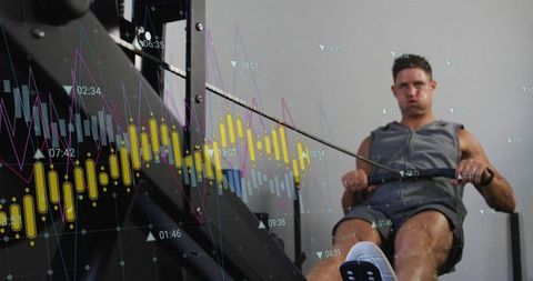 Athletic man rowing on ergometer with candlestick analytics overlay for performance data
