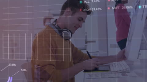 Businessman Analyzing Financial Data at Computer in Office