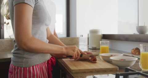 Woman Preparing Breakfast in Modern Kitchen