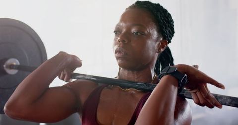 Determined Woman Engaged in Intense Weightlifting Workout in Gym - Download Free Stock Images Pikwizard.com