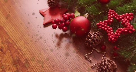 Festive Red Christmas Decorations on Wooden Table - Download Free Stock Images Pikwizard.com