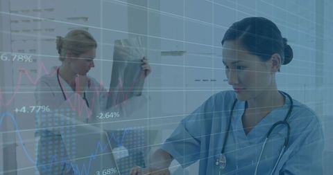 Healthcare Professionals Analyzing Data with Financial Graphs