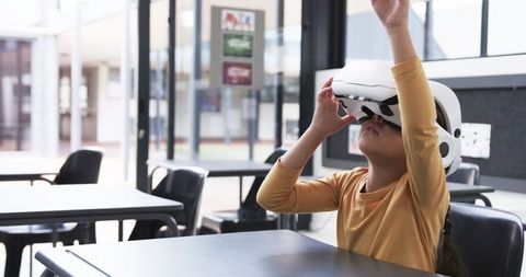 Young Girl Engaging with Virtual Reality in Class