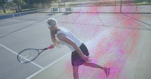 Female Tennis Player Coated in Pink Powder on Sunny Court