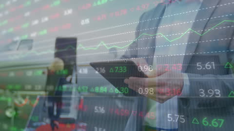 Businessman Analyzing Financial Market Trends on Tablet