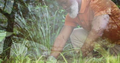 Man Tending Garden with Innovative Light Overlay