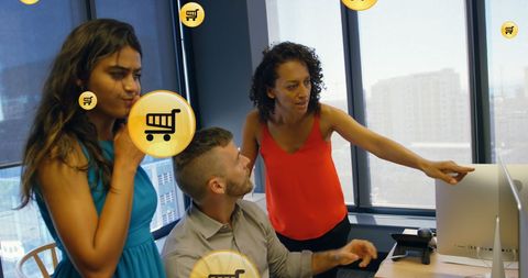 Diverse team analyzing digital data in office workspace