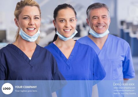 Smiling healthcare professionals in blue scrubs with surgical masks