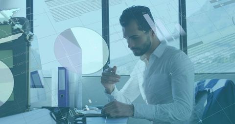 Businessman Analyzing Financial Data with Virtual Infographic Overlay