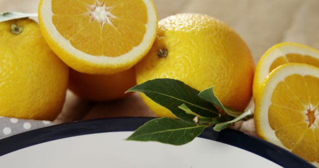 Fresh Yellow Mango Oranges with Green Leaves on Table - Download Free Stock Images Pikwizard.com