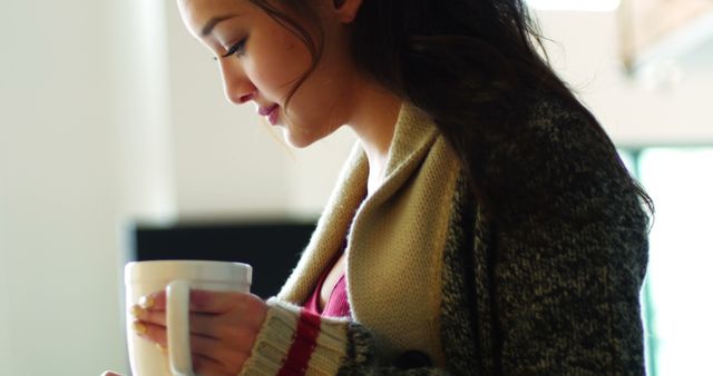 Young Woman Enjoying Hot Beverage at Home - Download Free Stock Images Pikwizard.com