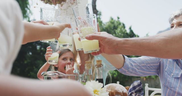 Family Toasting with Lemonade on Sunny Summer Day - Download Free Stock Images Pikwizard.com