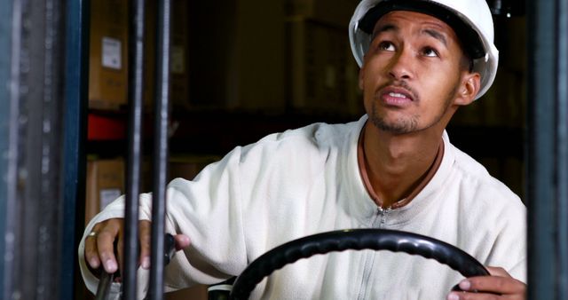 Warehouse Worker Operating Forklift with Focus - Download Free Stock Images Pikwizard.com