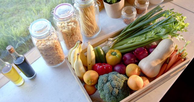 Assorted Fresh Vegetables and Fruits with Pantry Essentials on Kitchen Counter - Download Free Stock Images Pikwizard.com