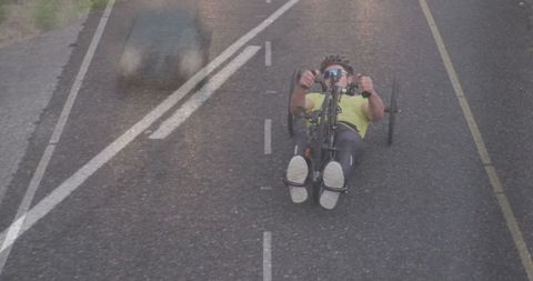 Recumbent Bike Rider Venturing on Countryside Road
