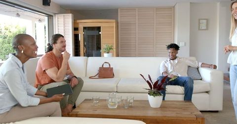 Friends Having Casual Conversation in Modern Living Room