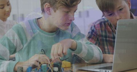 students engaged in robotics and coding with digital interface overlay - Download Free Stock Images Pikwizard.com