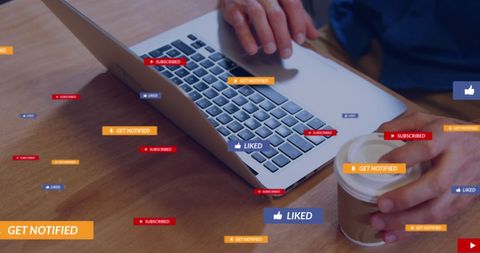 Social Media Engagement at Cafe: Man Typing on Laptop