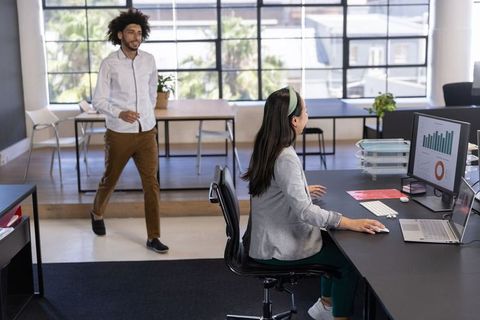 Diverse Team Engaging in Collaborative Office Environment