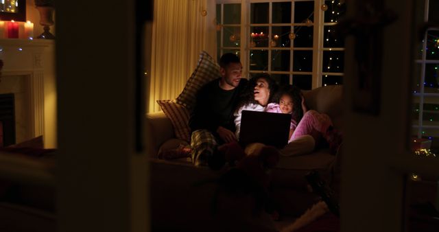 Family Celebrating Cozy Holiday Evening at Home with Festive Decorations - Download Free Stock Images Pikwizard.com