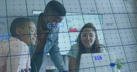 Multiracial staff engaged in data analysis meeting