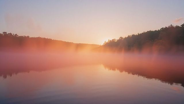 Sunrise Over Misty Lake with Forest Reflection