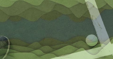 Tennis ball on multicolored court with player sneaker