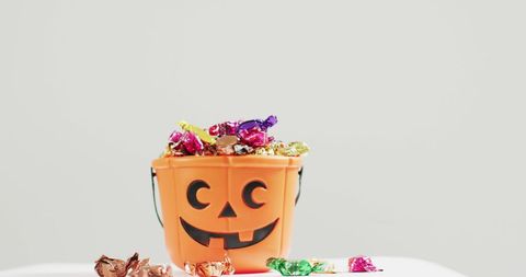 Halloween Pumpkin Bucket with Colorful Candy - Download Free Stock Images Pikwizard.com