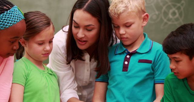 Teacher Engaging with Diverse Group of Young Students - Download Free Stock Images Pikwizard.com