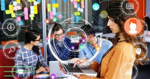 Collaborative Teamwork in Modern Office with Digital Interface Display