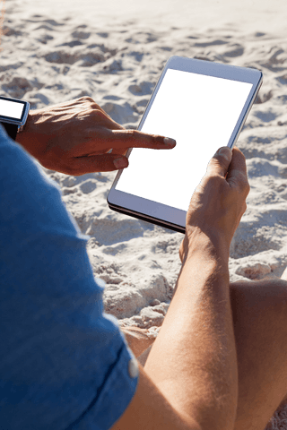 Person Using Tablet on Sunny Beach with Transparent Screen - Download Free Stock Videos Pikwizard.com