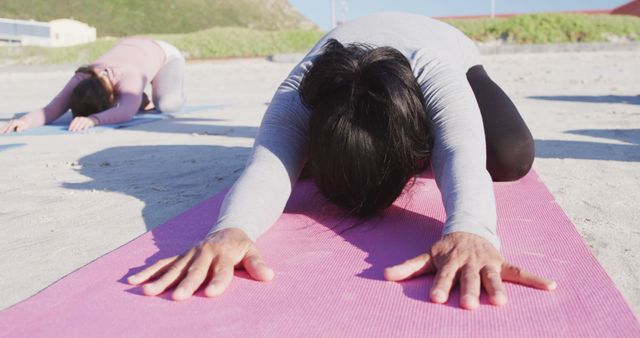 Women Practicing Child's Pose Yoga Exercise on Beach Mat - Download Free Stock Images Pikwizard.com