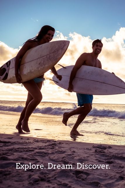 Joyful Surfers Running with Surfboards at Sunset on Beach - Download Free Stock Templates Pikwizard.com