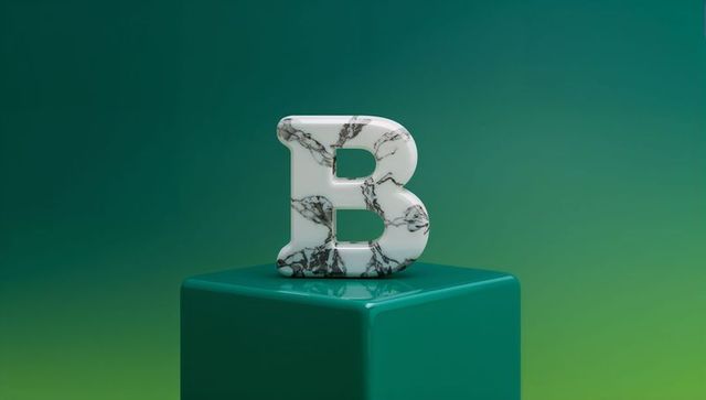 Marble-textured letter b on teal pedestal indoor display