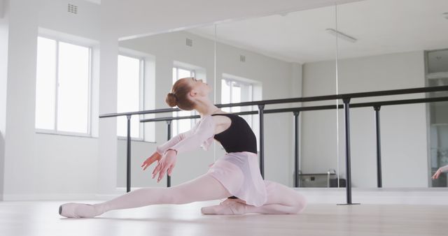 Young Ballet Dancer Performing Graceful Pose in Studio - Download Free Stock Images Pikwizard.com