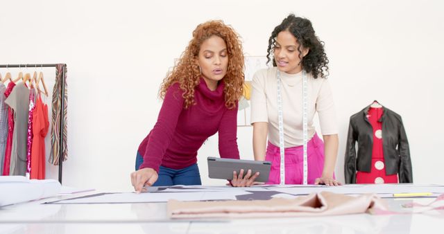 Two Female Fashion Designers Working Together in Studio - Download Free Stock Images Pikwizard.com