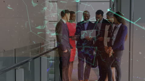 Diverse Business Team Discussing in Hallway Amidst Digital Networking