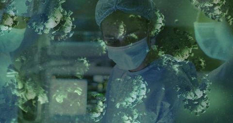 Medical researcher wearing mask and gown monitoring lab with floating virus particles